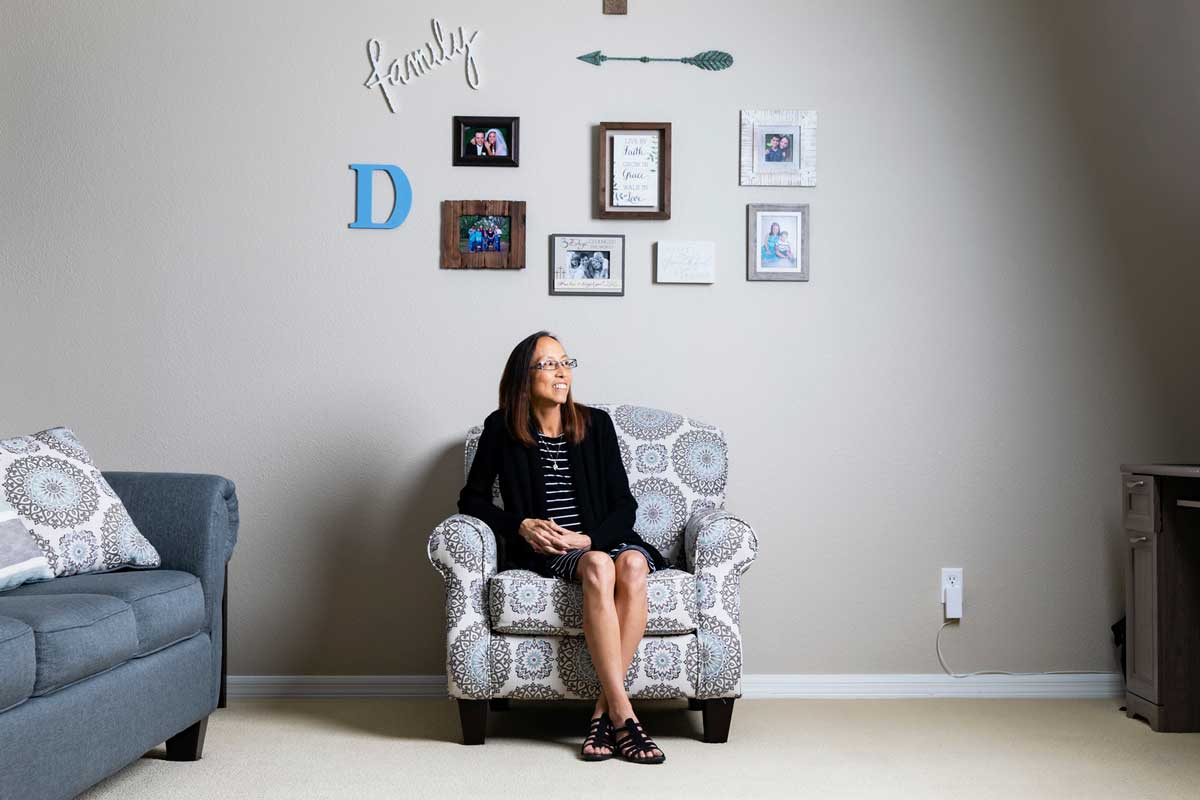 Joyce DeGennaro sits in an arm chair 