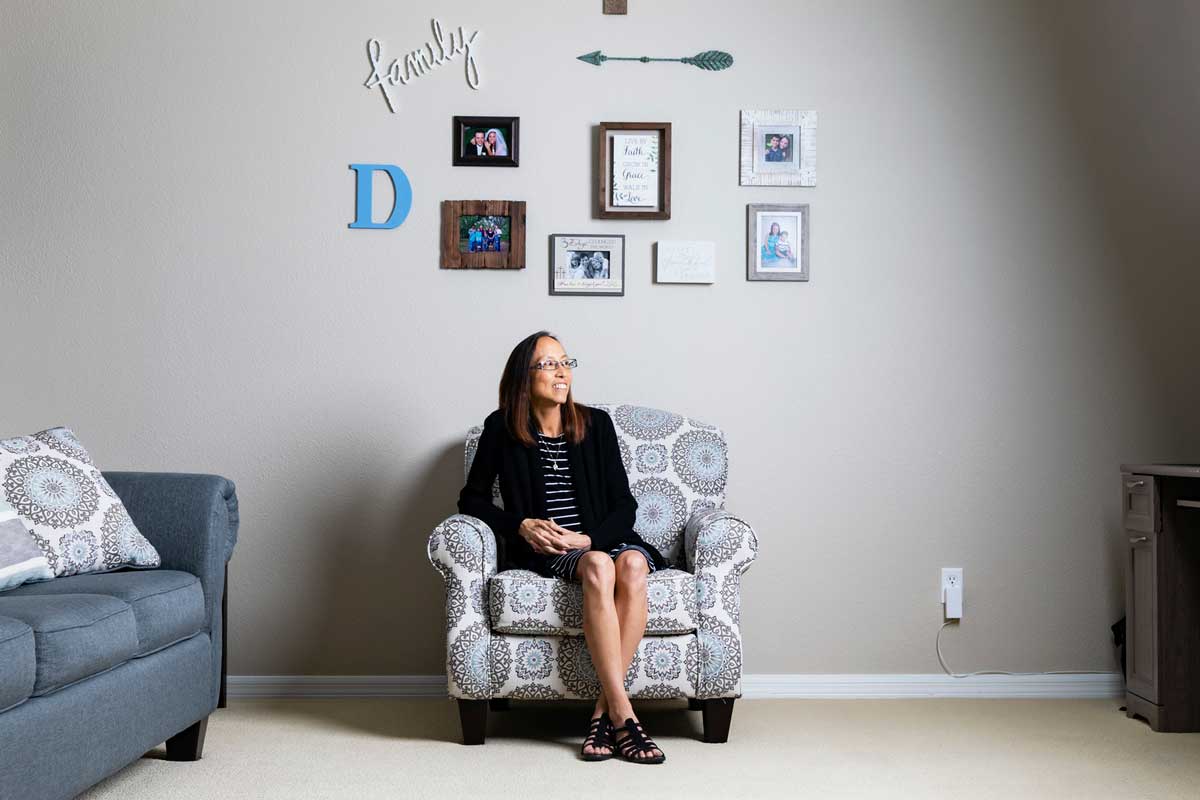 Joyce DeGennaro sits in an arm chair