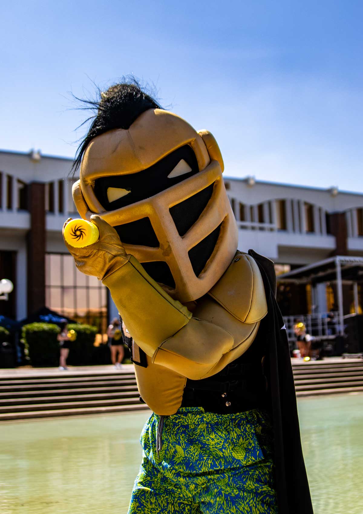 Knightro aims water gun at camera