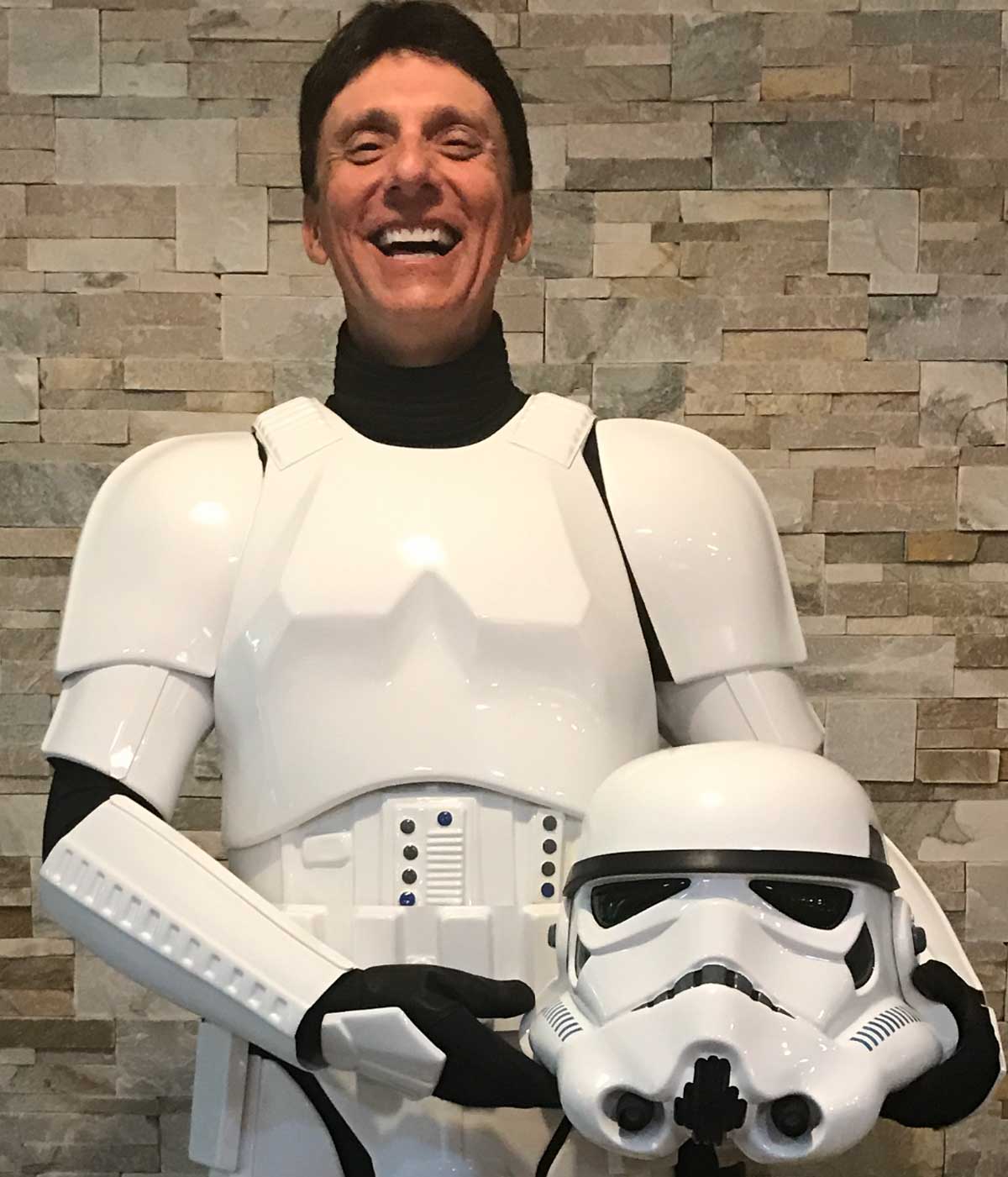 Peter Telep in sandtrooper costume, holding helmet in his hands