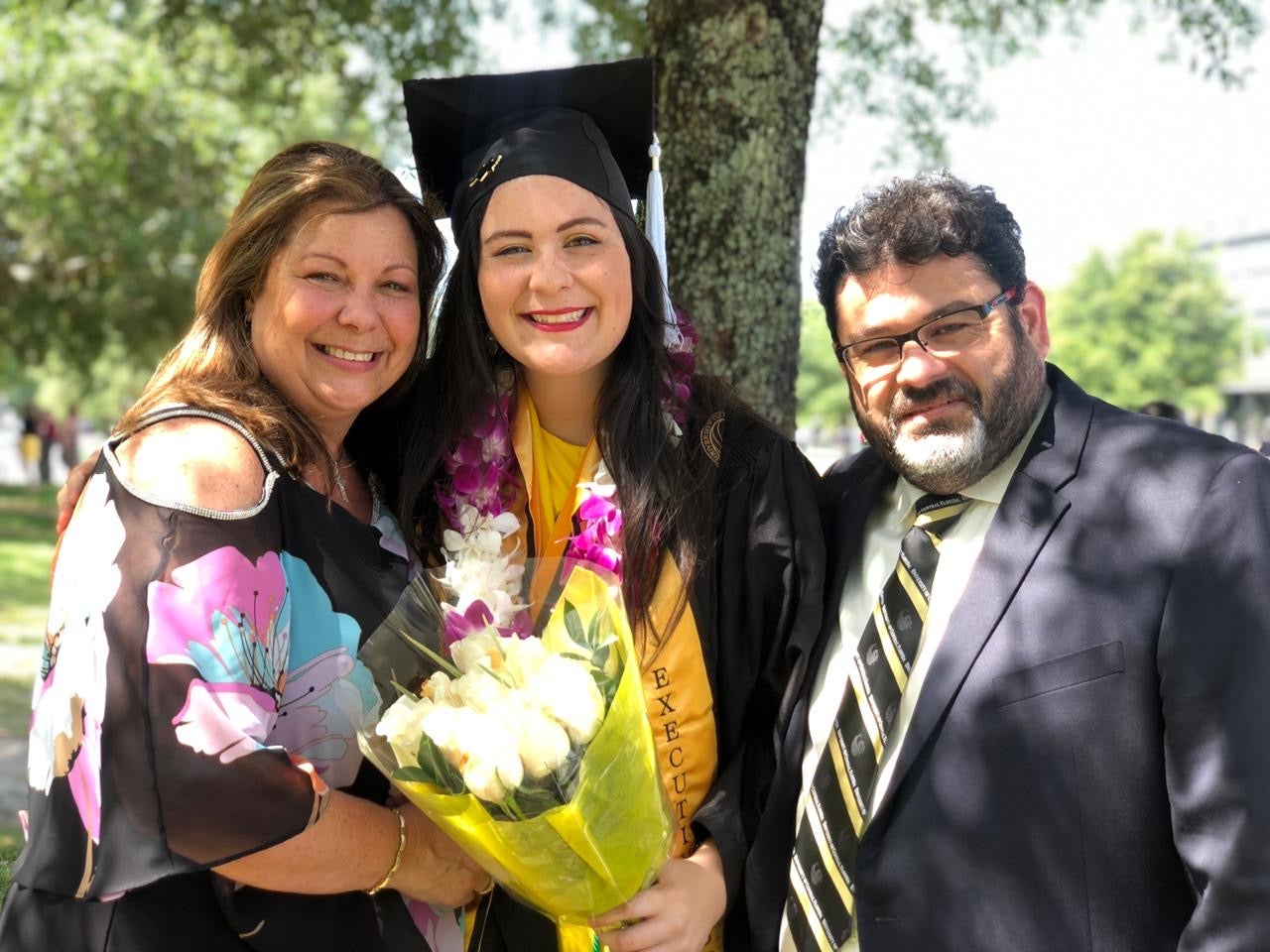 Ana Beltran and her family at UCF's graduation ceremony 