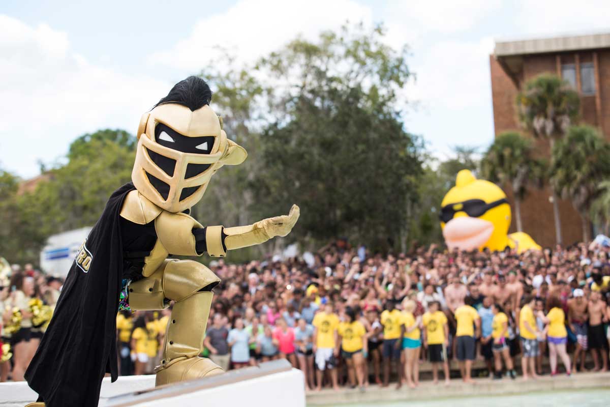 Knightro near Reflecting Pond, gesturing crowd to come to him