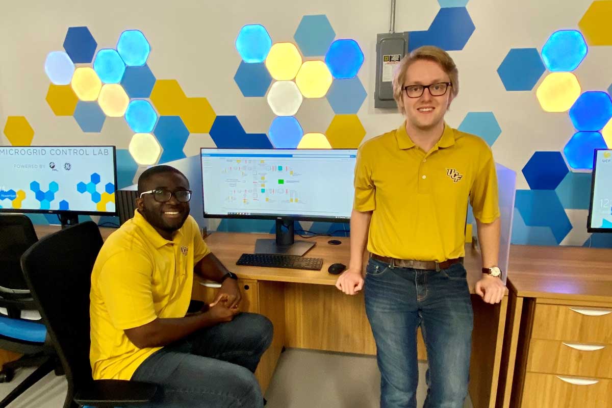 Kwasi Opoku (left) and Max Caroll '21 (right) near computers and desks 
