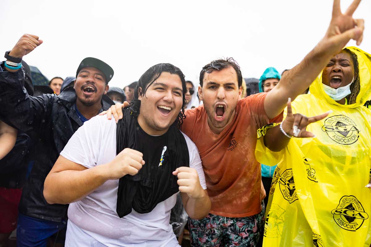 Closeup of students, wet from rain, excited for Spirit Splash