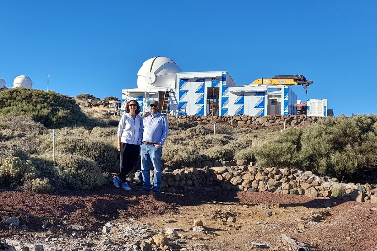 Noemi and Javier outside the twin telescopes