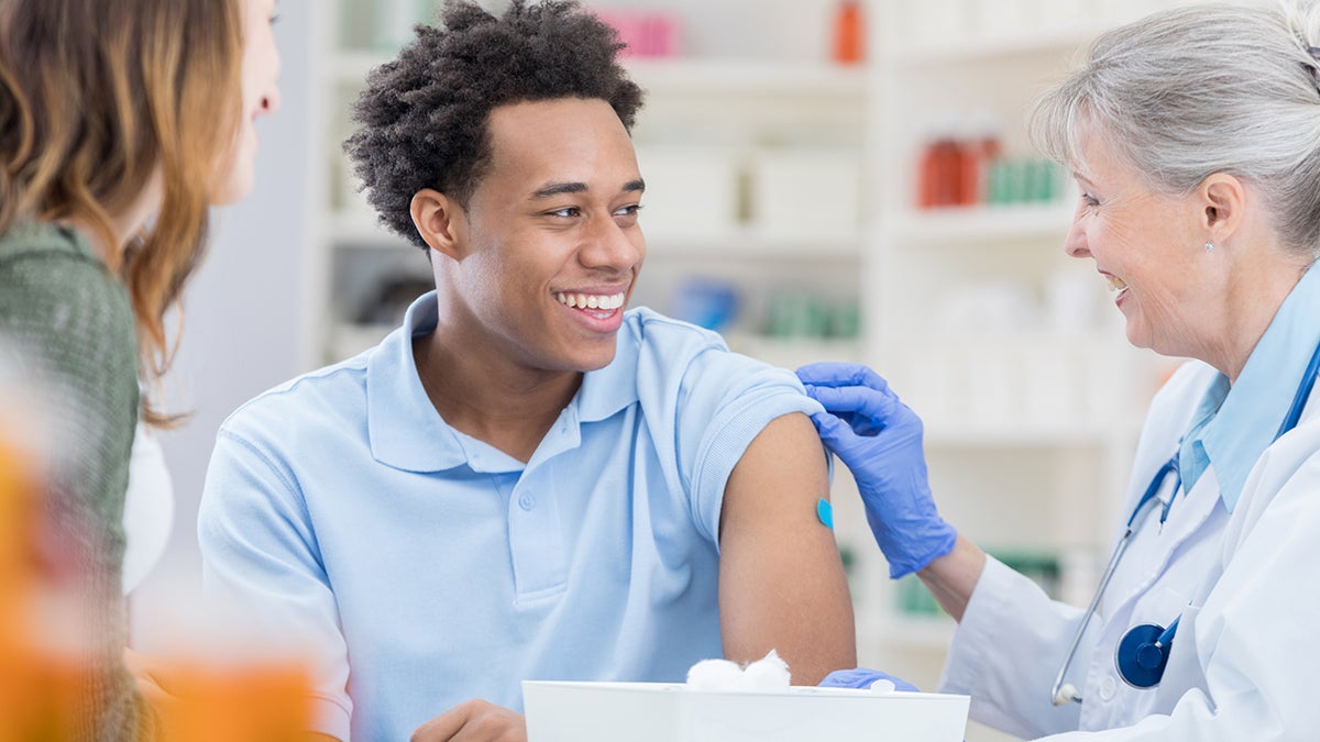 Young man getting vaccinated.