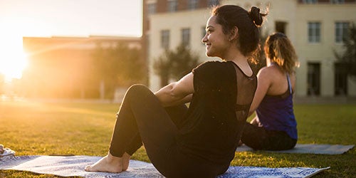 ucf students practicing yoga on memory mall