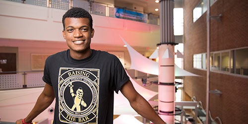 male ucf student smiling at camera