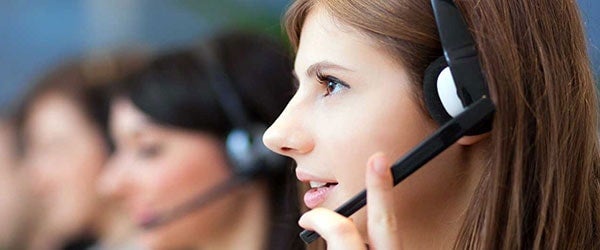 profile view of female using headset to talk to ucf student