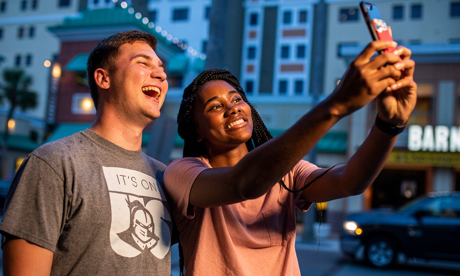 Students taking selfies to post on UCF Social channels.