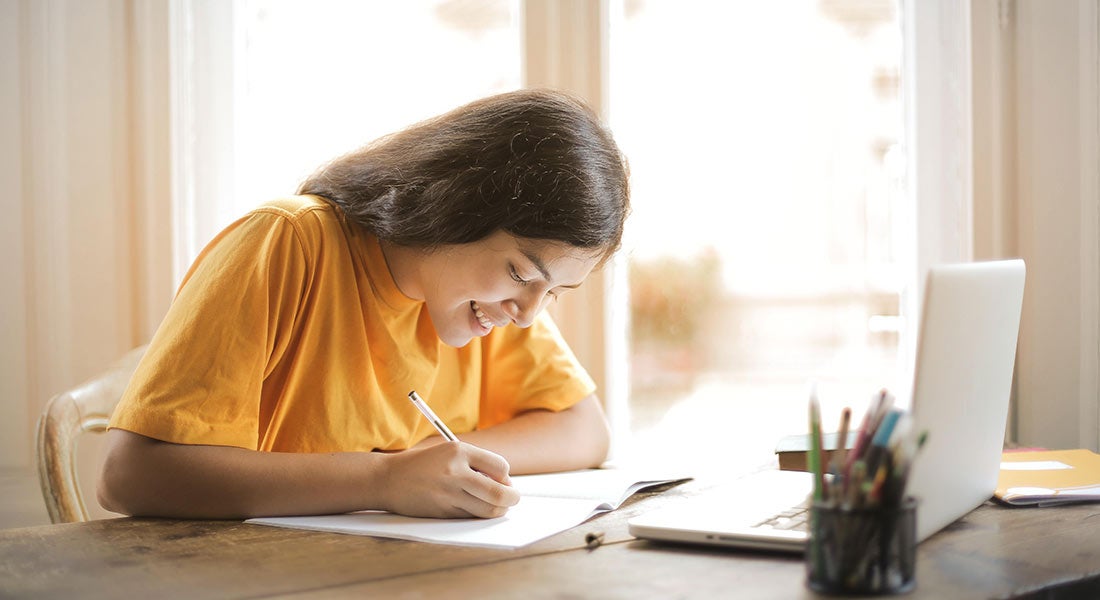 Girl doing homework at computer