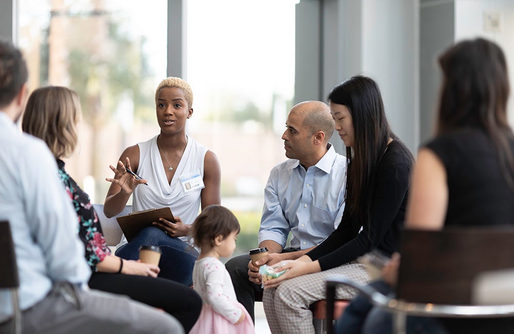 Social worker engaging with a group.