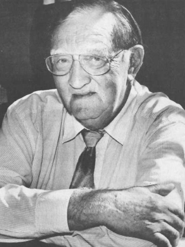 A close-up portrait of an older main wearing wireframe glasses. A close-up portrait of an older main wearing wireframe glasses.