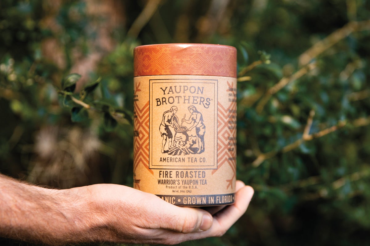 a hand holding yaupon brothers fire roasted tea