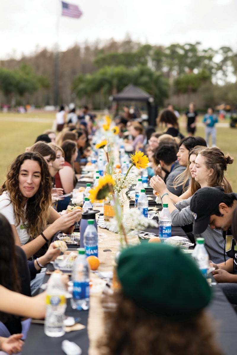 A table of students eating.
