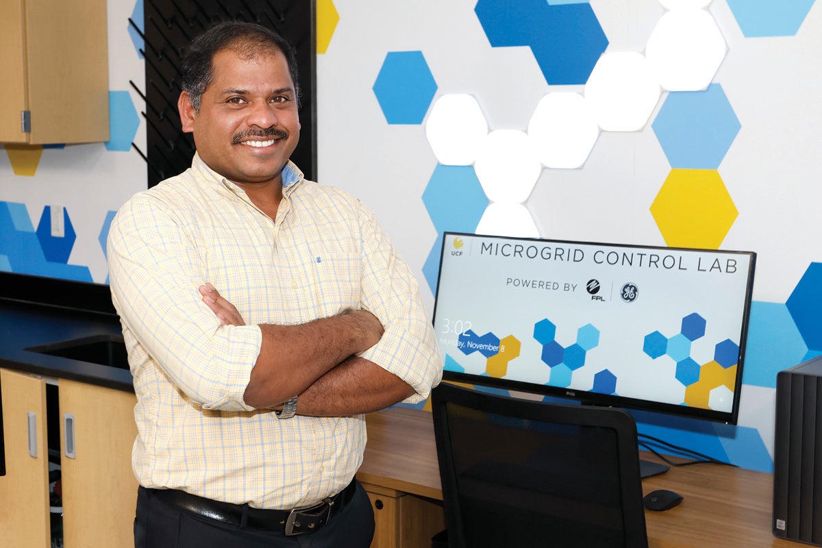 Giji Skaria, a lab manager in the Department of Electrical and Computer Engineering, posed in front of a computer.