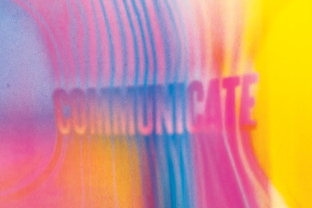 The word "Communicate" in a colorful illustration.