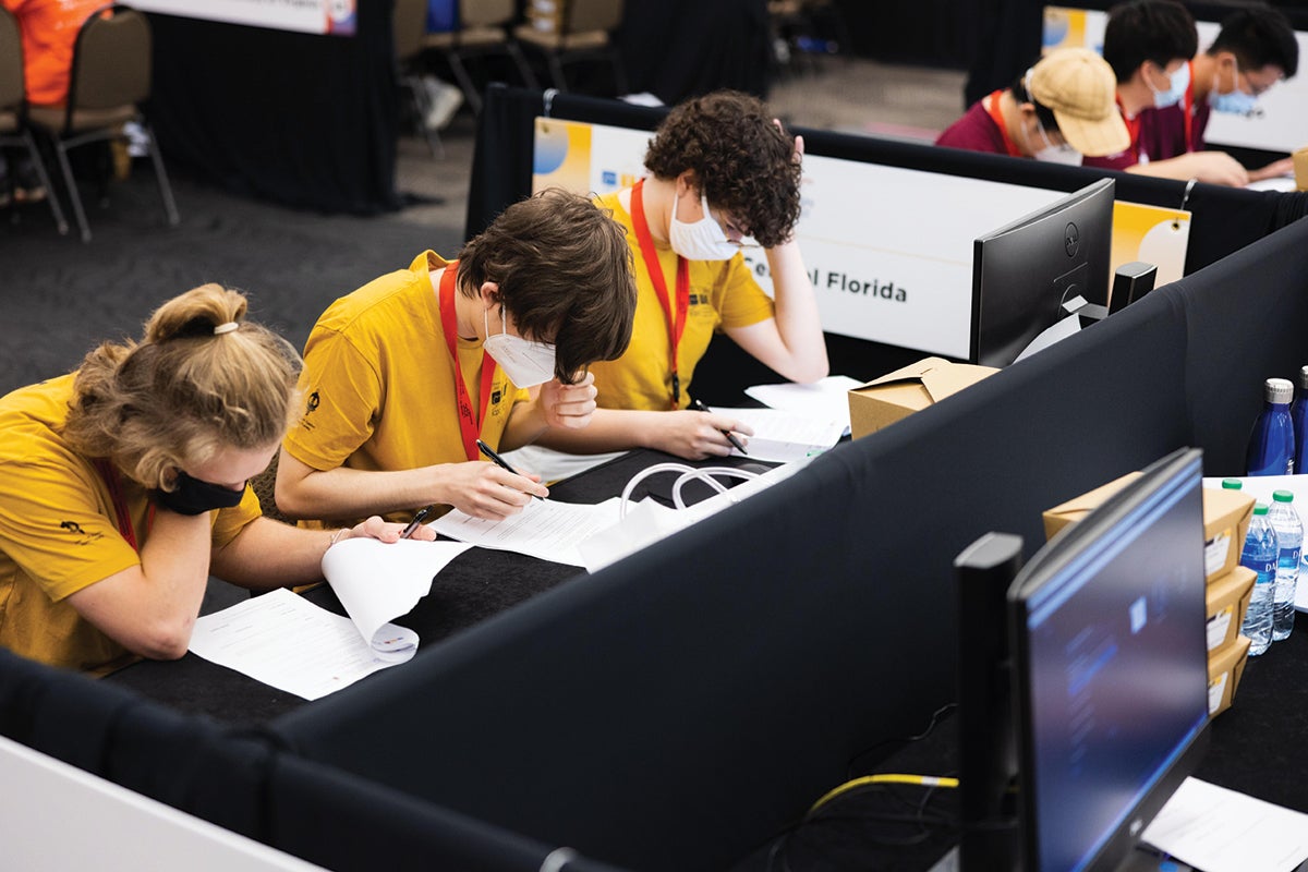 UCF programming students competing in the Pegasus Ballroom during the competition.