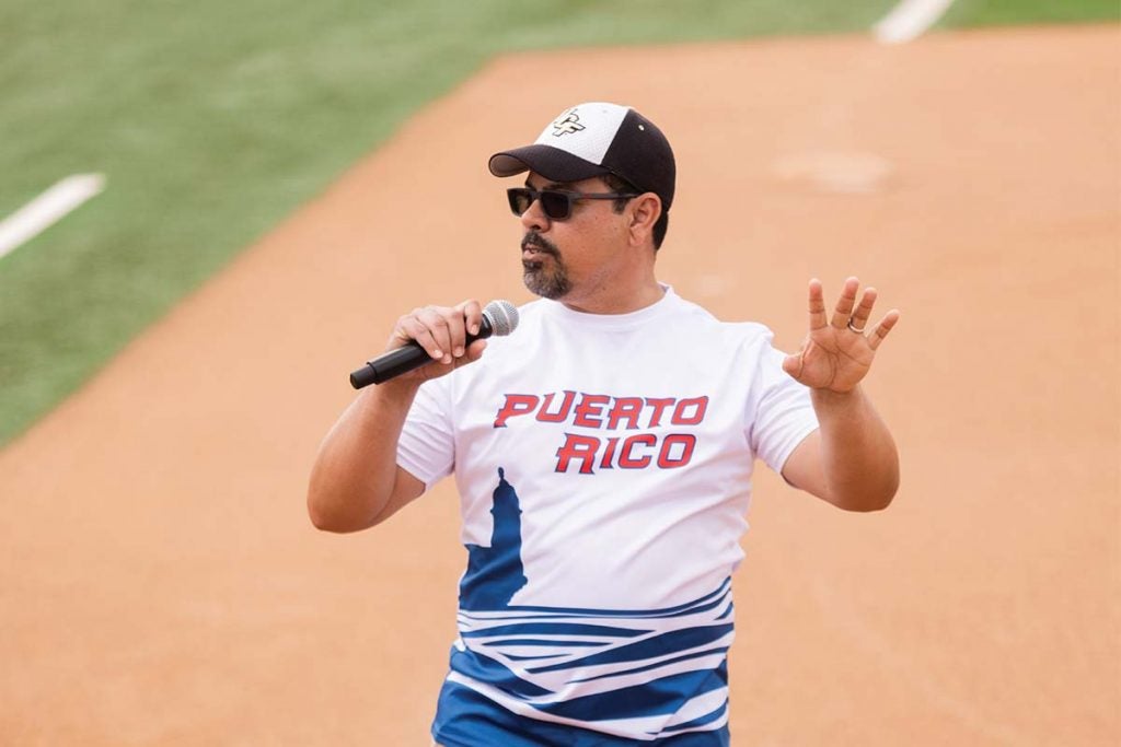 Professor of Sociology and Puerto Rico Research Hub Director Fernando Rivera speaks into a microphone