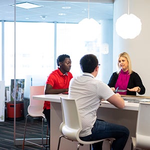 Students sitting in a common area studying