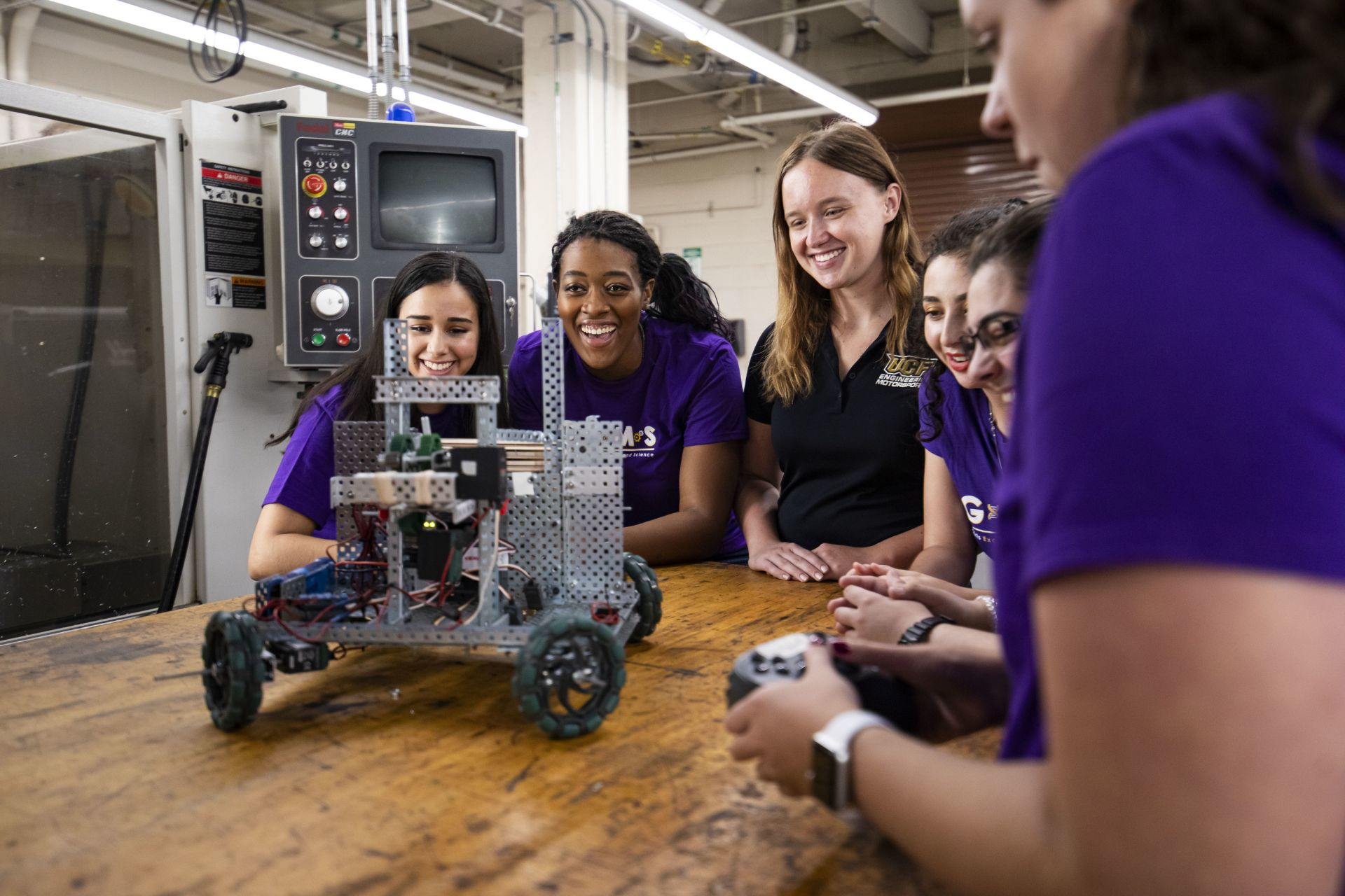 Engineering students test a robot.