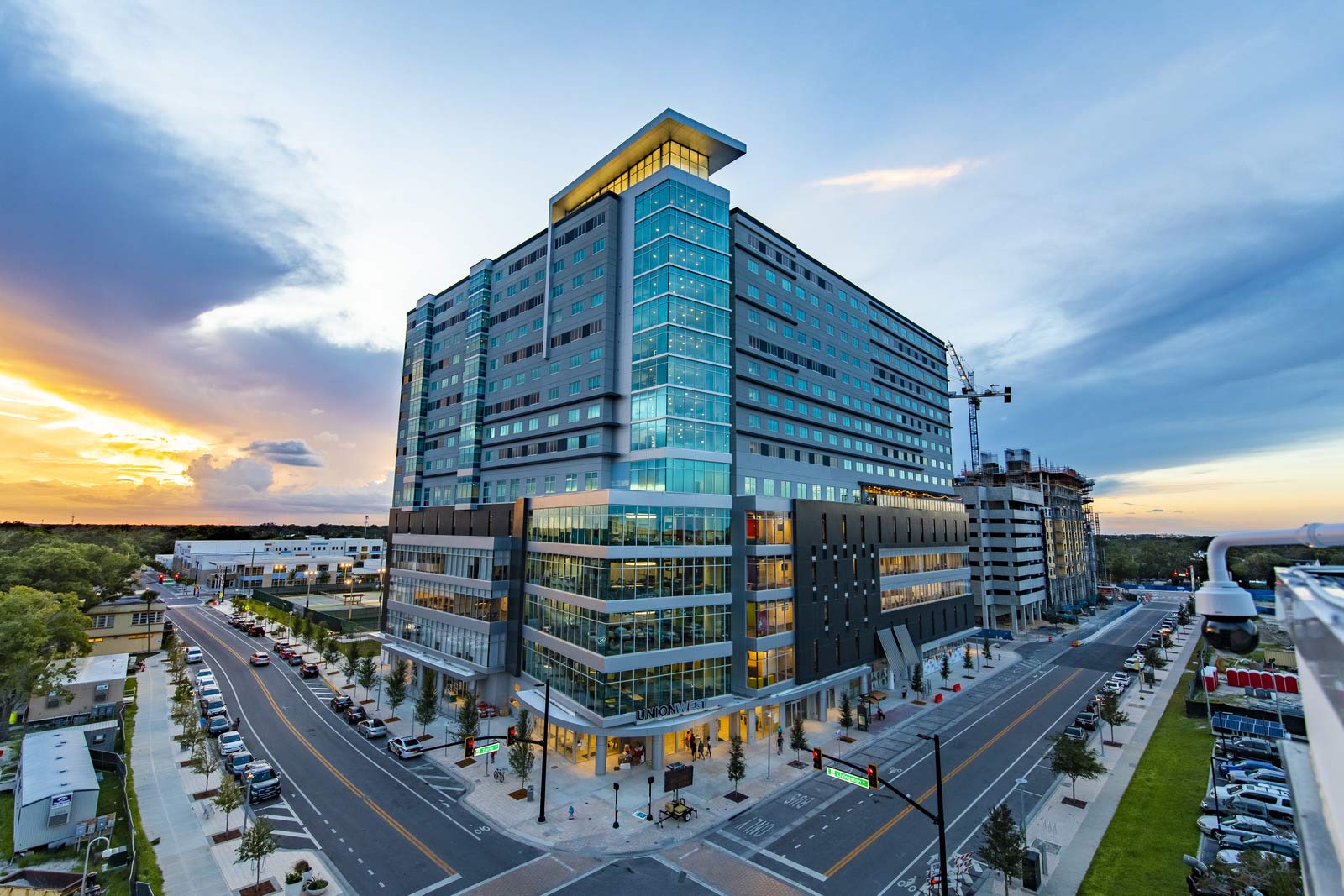 The sun sets behind Union West in Downtown Orlando