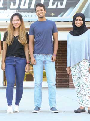 three international ucf students smiling at camera