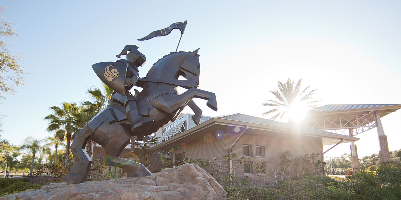 Background Image of UCF Knight on horseback leading the charge to the future of higher education