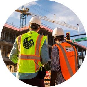 two construction engineers overlook a construction site