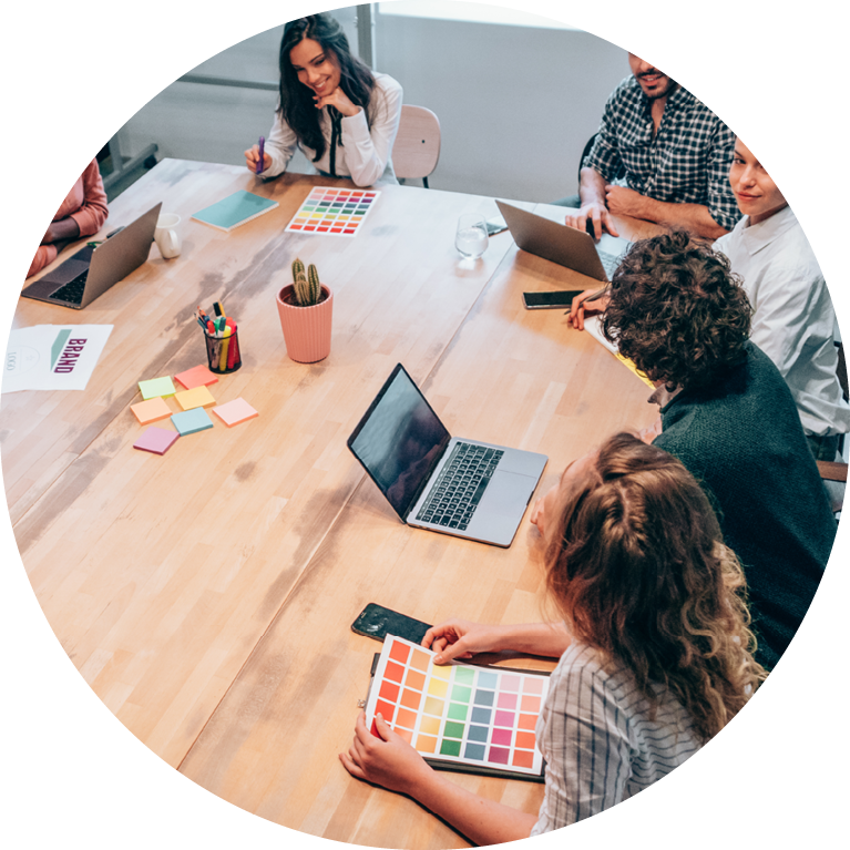 Team of people working at table