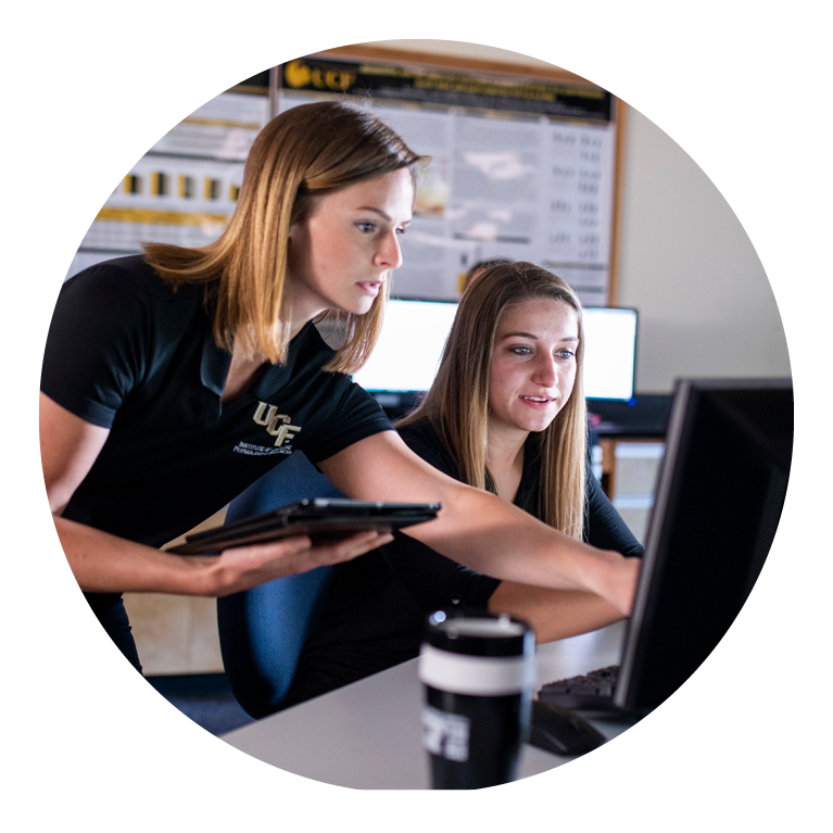 Two females looking at computer screen together