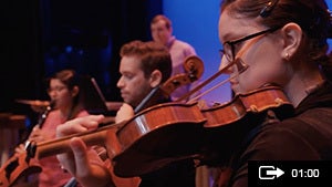 Woman playing violin during UCF celebrates the arts