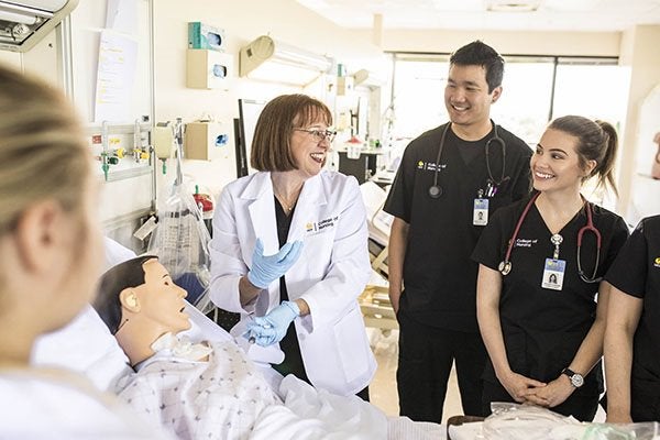 UCF Nursing professor teaches nurse practitioners using an advanced simulation system