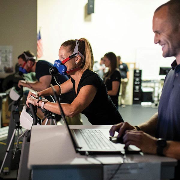 male and female ucf students working out at college of health professions and sciences