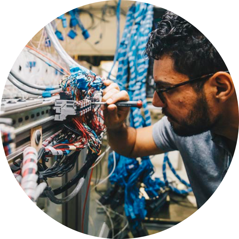 Electrical engineering student working on wires and cables