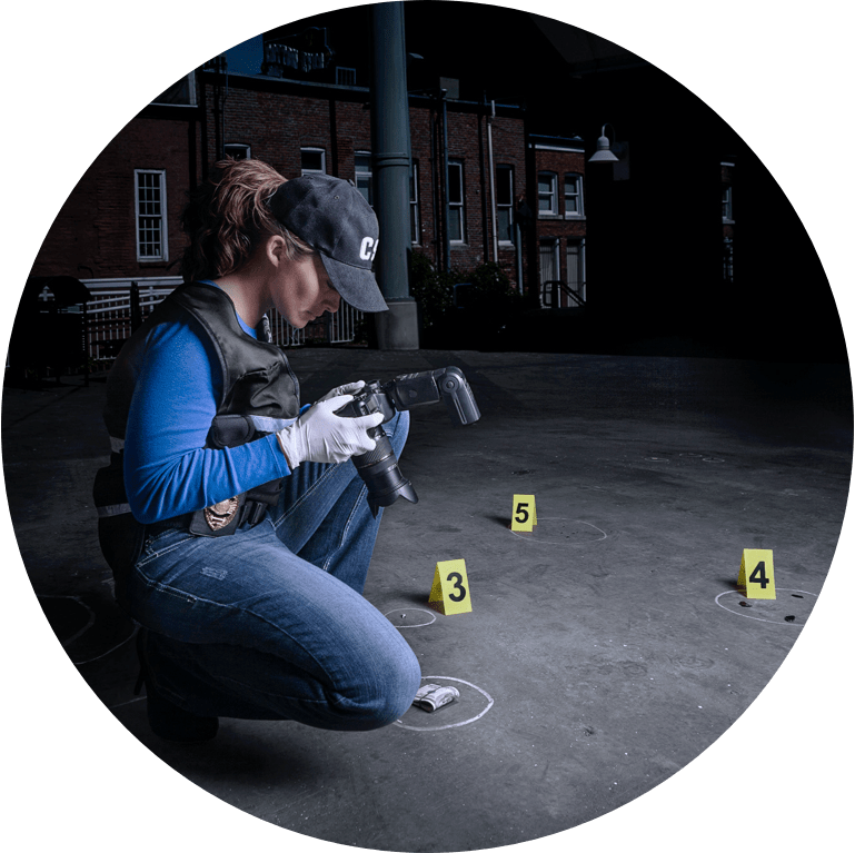 Crime Scene Analyst taking photos during an investigation