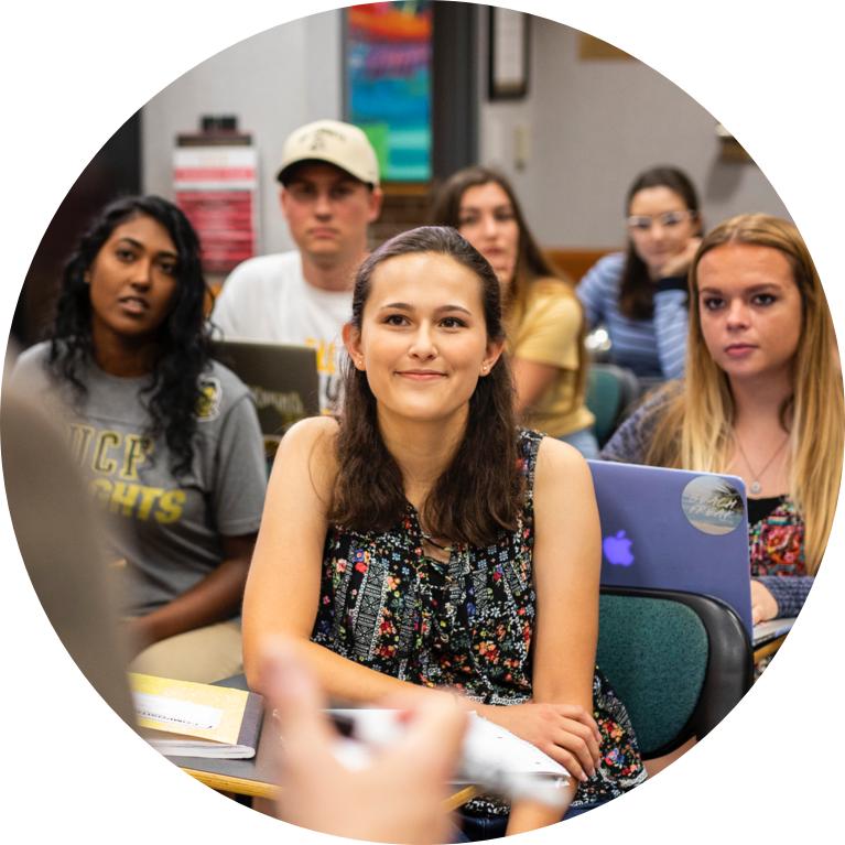 Students in classroom listening to teacher