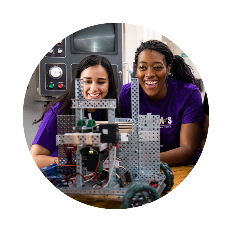 Two female students working on engineering project