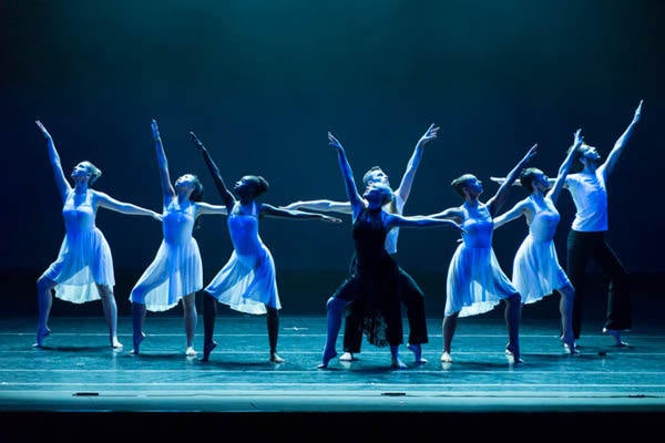 Students performing a dance on stage