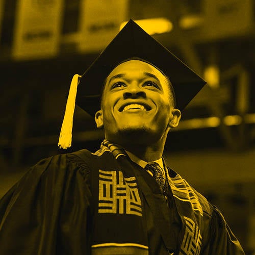 male student in academic regalia