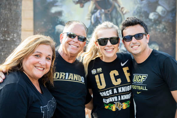 Two students with their mother and father during Family Weekend