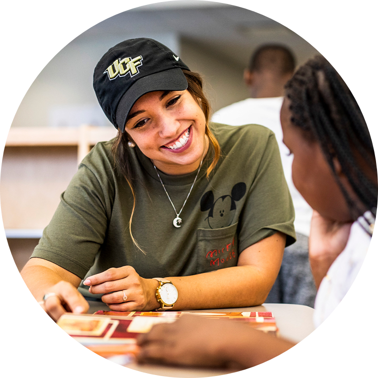 UCF student teaching child how to read