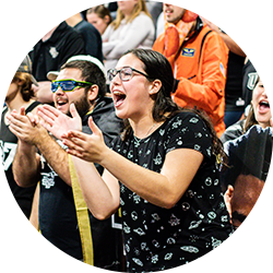 Fans cheering at a UCF football game