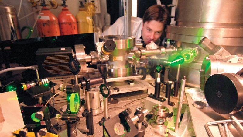 Man looking at laser equipment