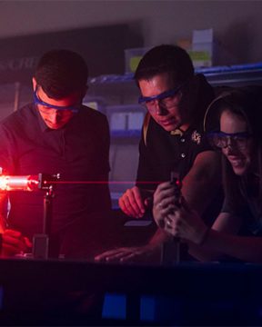 ucf researchers working with lasers in aerospace optics lab