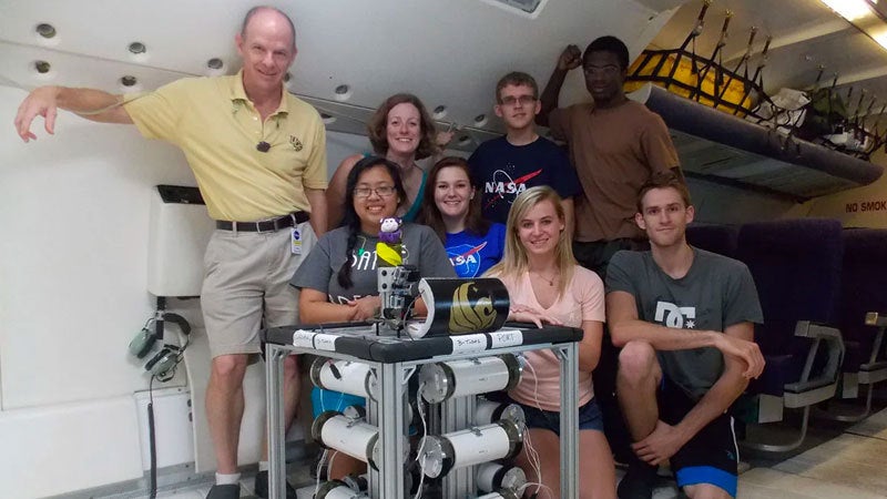 UCF faculty and students with a research project