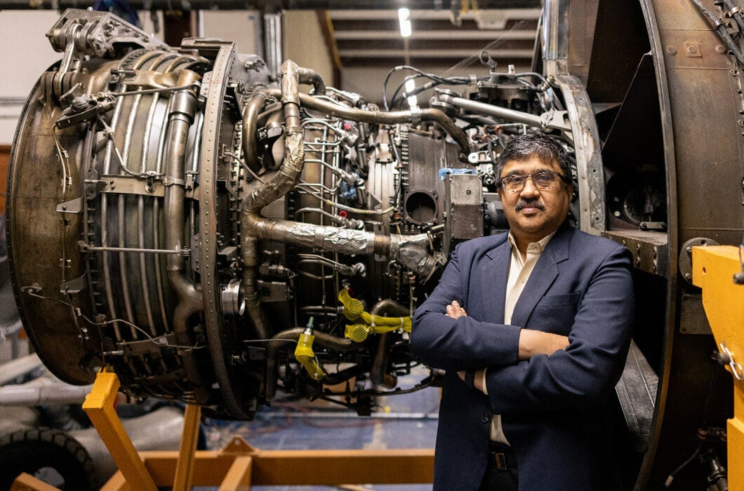 Jayanta Kapat stands in front of large machinery at UCF’s Center for Advanced Turbomachinery and Energy Research.