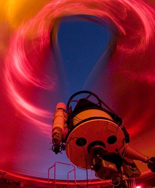 A telescope pointing at the night sky