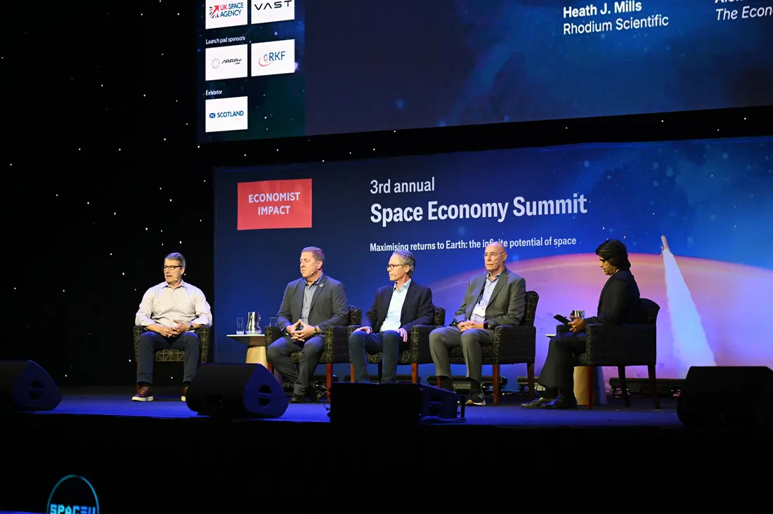 Four panelists seated on stage at the Economist Space Economy Summit in 2025.