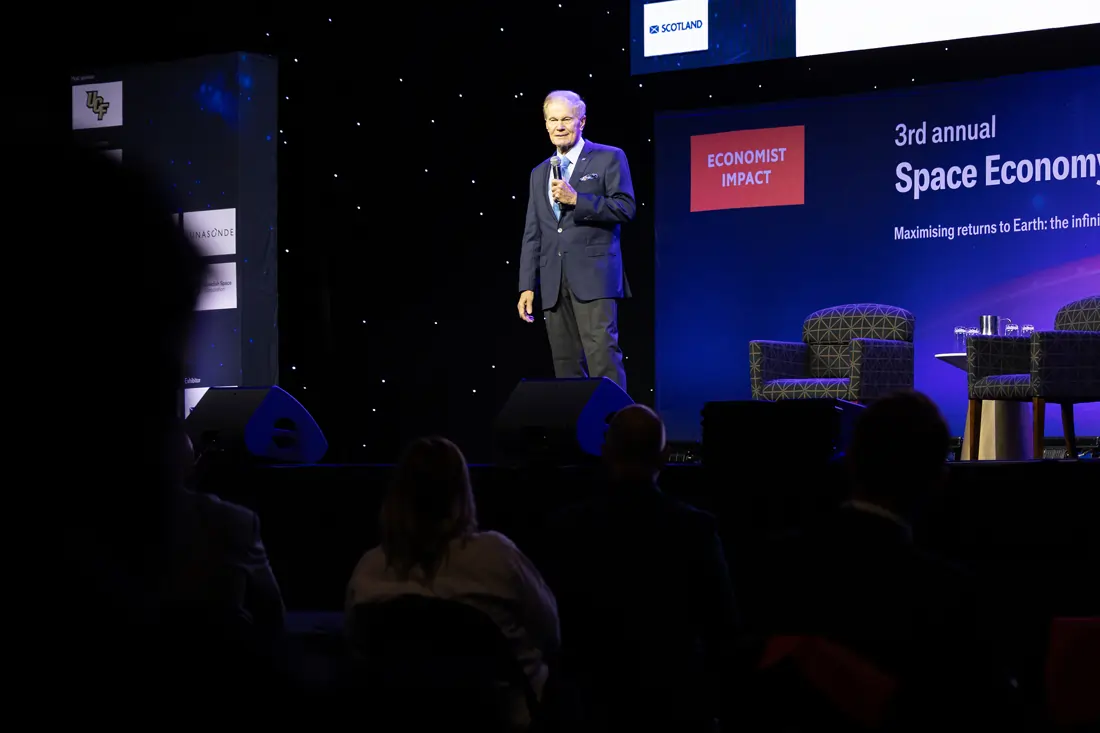 Bill Nelson standing on stage speaking at the Economist Space Economy Summit in 2025.